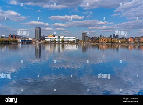 View Of Manchester Skyline Reflection In Water In Salford Quays