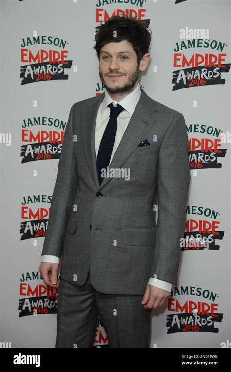 Iwan Rheon Poses For Photographers Upon Arrival At The Empire Film