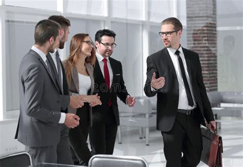 Businessmen Discussing Business Perspectives In Office Stock Photo