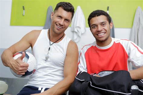 Mature Coach And Teen Footballer In Changing Room Stock Photo Image Of Park Protection 240920140