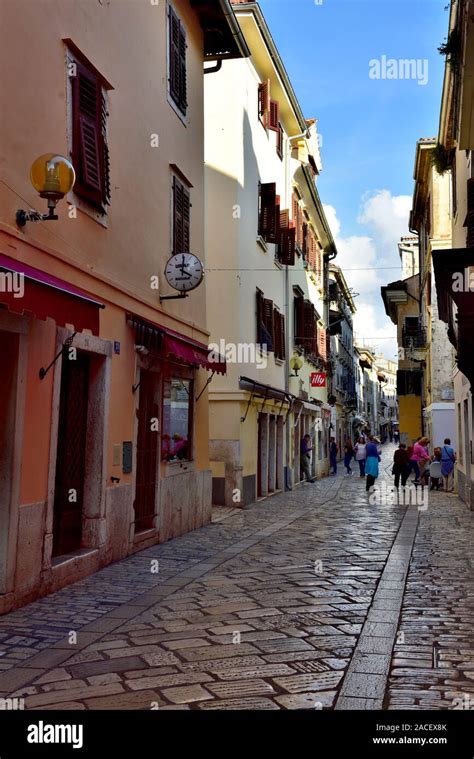 Street Scene Of Marble Paved Mainly Pedestrian Small Shopping Street