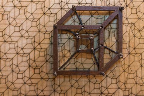 2d Tesseract Wall Art Sculpture With Tesselated Tesseract Background Paisley Garbage