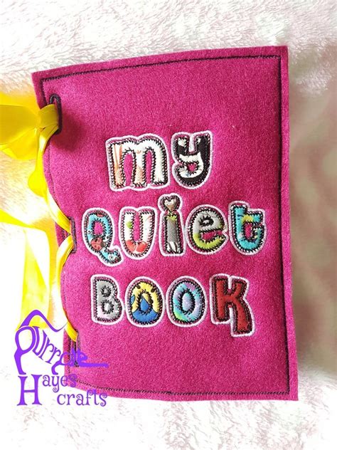 A Pink Book With The Words My Quillet Book On It And A Yellow Ribbon