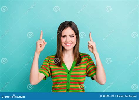 Photo Of Sweet Adorable Woman Dressed Striped Cardigan Pointing Two Fingers Up Empty Space