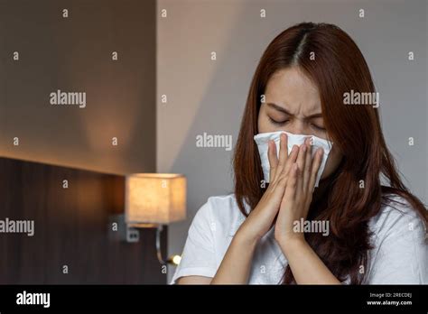 Asian Beautiful Woman Suffering From Runny Nose Or Nasal Blocking