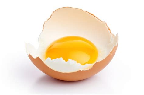 Premium Photo Cracked Egg Shell With Yolk Inside On A White Or Clear