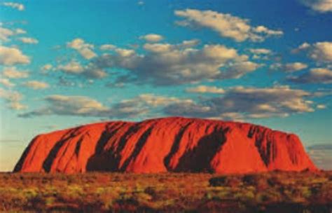 Uluru Or Ayers Rock Is A Massive Sandstone Monolith In The Heart Of