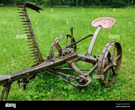 Old Sickle Bar Mower On The Grass Stock Photo Alamy