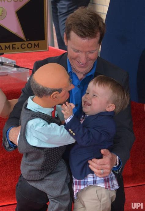 American Ventriloquist And Comedian Jeff Dunham Looks On As His Son