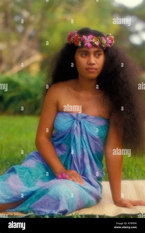 Polynesian Woman With Haku Lei And Sarong Against A Background Of Muted