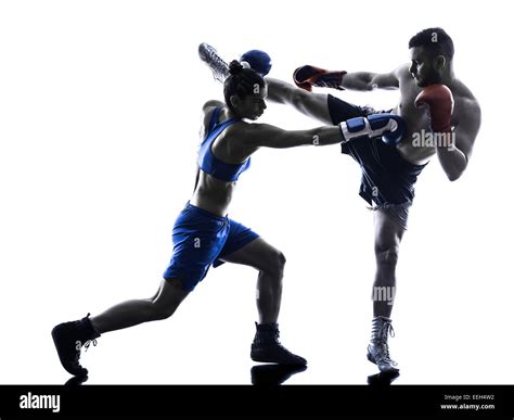 One Woman Boxer Boxing One Man Kickboxing In Silhouette Isolated On