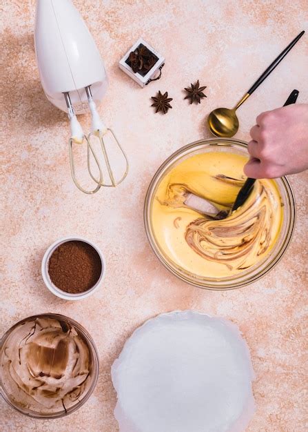 Free Photo Electric Food Mixer Cocoa Powder Anise And A Person