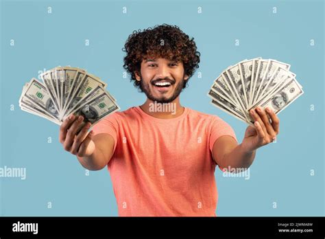 Happy Indian Man Holding Cash In Both Hands And Smiling Stock Photo Alamy