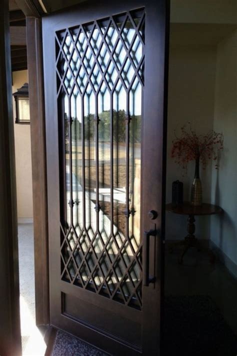 A Wooden Door With Metal Bars On It