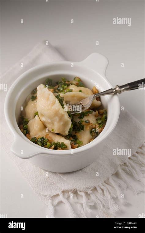 Potato Dumplings With Fried Bacon And Green Onions Stock Photo Alamy