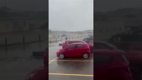 Stormy Bay And Car Driving Down Flooded Streets As Fiona Batters Canada