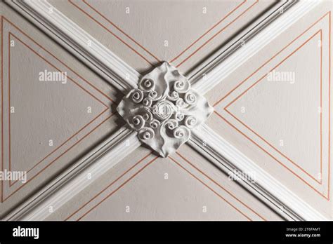 White Gypsum Bas Relief Ceiling Design Details And Red Lines Over Beige