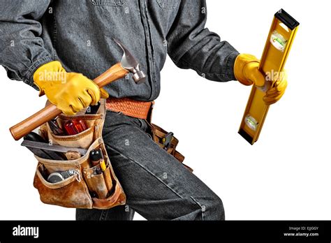 Man In Black Denim Wearing Used Tool Belt Filled With Carpenter Tools