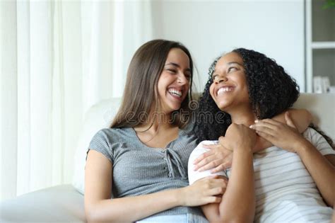 Happy Interracial Lesbian Coupke Looking Each Other In Love Stock Image