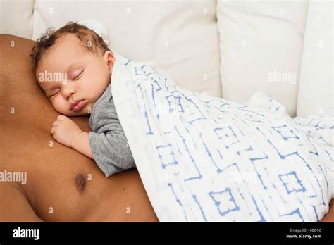 Baby Sleeping On Fathers Chest Stock Photo Alamy