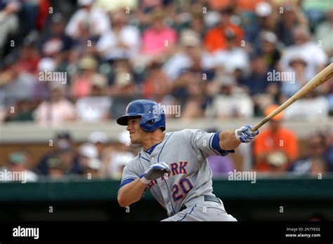 New York Mets' Anthony Recker (20) bats during an exhibition spring ...