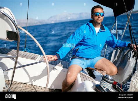 Handsome Strong Man Sailing With His Boat Stock Photo Alamy