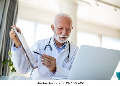 Serious Old Mature Professional Male Doctor Stock Photo