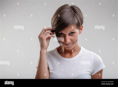 Mature Woman Holding Aside Her Hair Stock Photo Alamy