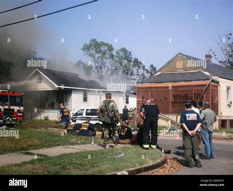 Aftermath - Miscellaneous - 26-HK-47-176. fire fighters putting out a house fire, with a fire ...