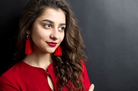 Premium Photo Portrait Of A Smiling Beautiful Indian Girl Close Up Face On A Black Background