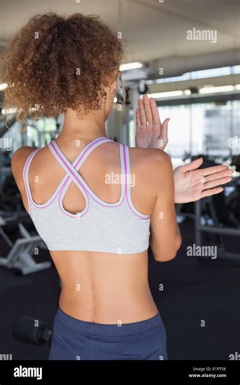 Fit Woman Stretching Her Arms Stock Photo Alamy