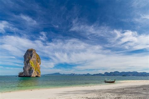 Premium Photo Long Tail Boat On White Sand Beach On Tropical Island