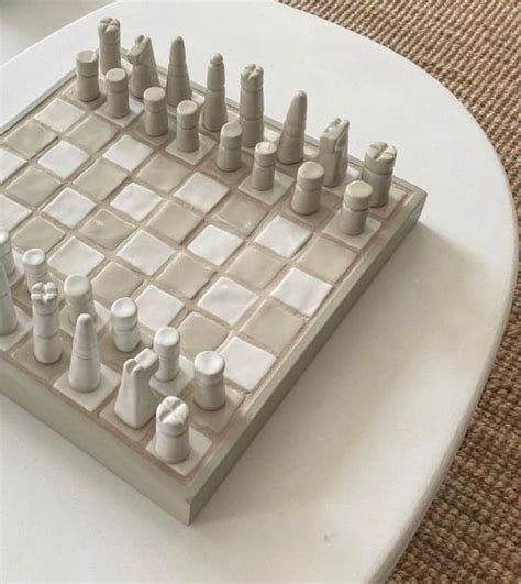 A Minimal Wooden Chess Board Inspired By The Yoruba Game Ayo Merges Two