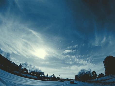 Premium Photo | Fish eye view of road with sky in background