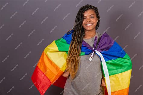 Premium Photo Young Afro Brazilian Woman Wearing Flag As A Cape Lgbt