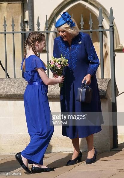 Camilla Queen Consort Receives A Posy From Harriet Aged 10 After