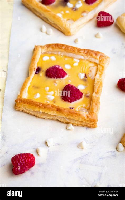 Raspberry White Chocolate And Custard Tarts Stock Photo Alamy