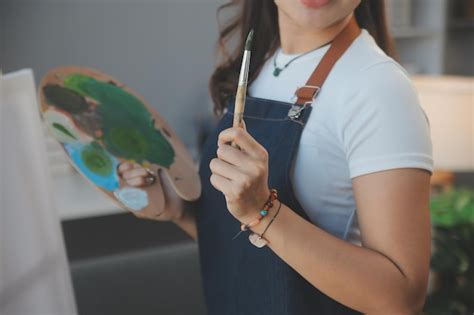 Premium Photo Cropped Image Of Female Artist Standing In Front Of An