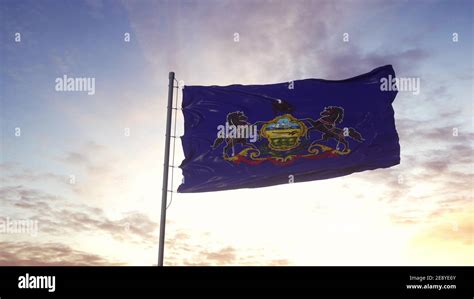 State Flag Of Pennsylvania Waving In The Wind Dramatic Sky Background