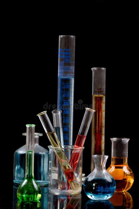 Various Laboratory Flasks With A Colored Reagents Pipette Stock Photo