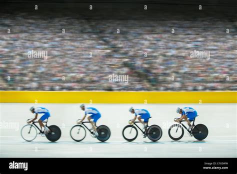 Track cycling team riding in velodrome Stock Photo - Alamy