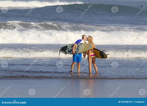 Lovely Couple With Surfboards On Beach Stock Image Image Of Beach