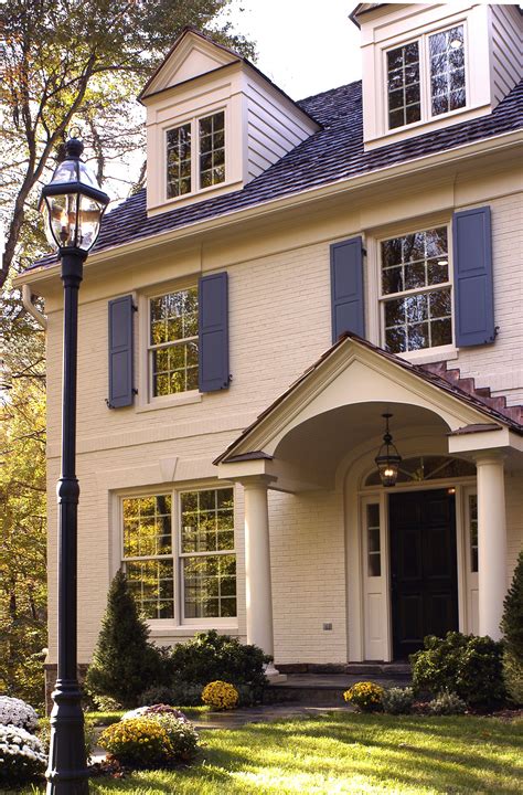 Colonial House White Siding Stone Brick Blue Shutters Windows