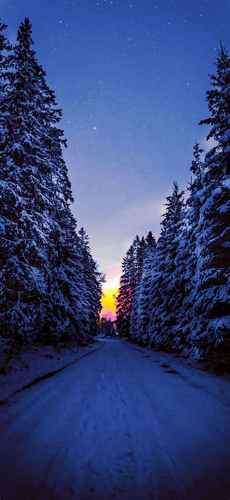 Dark Road Covered With Snow During Winter 4K Phone Wallpaper