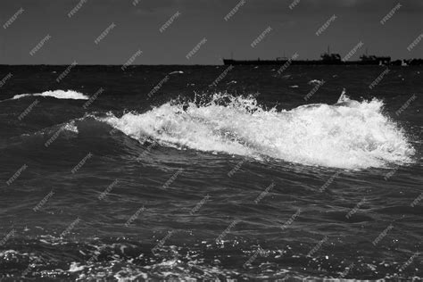 Premium Photo | Sea waves with foam black and white beach photography