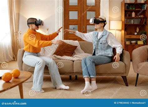 Young Lesbian Woman Couple Wearing Vr Goggles Playing Video Game Stock