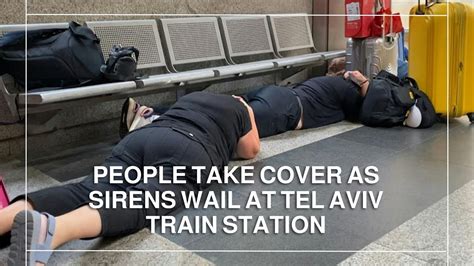 People Take Cover As Sirens Wail At Tel Aviv Train Station YouTube