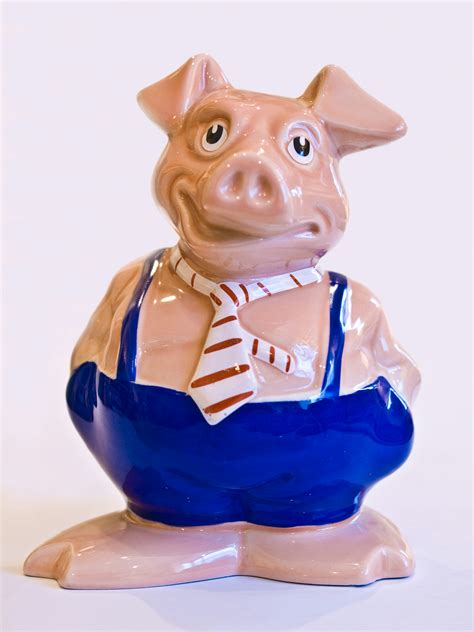 A Ceramic Pig Figurine With A Tie Around Its Neck Photo Free Piggy