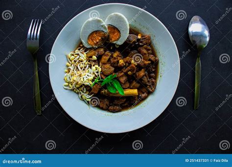 Rawon or Nasi Rawon/Rawon Rice is Traditional Indonesian Beef Black Soup Served with Sprouts ...