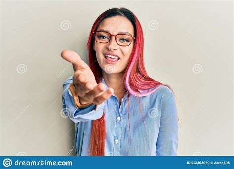 Young Caucasian Woman Wearing Casual Clothes And Glasses Smiling